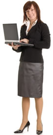 photo shows a CV Writing Expert writing a CV on a laptop whilst smiling